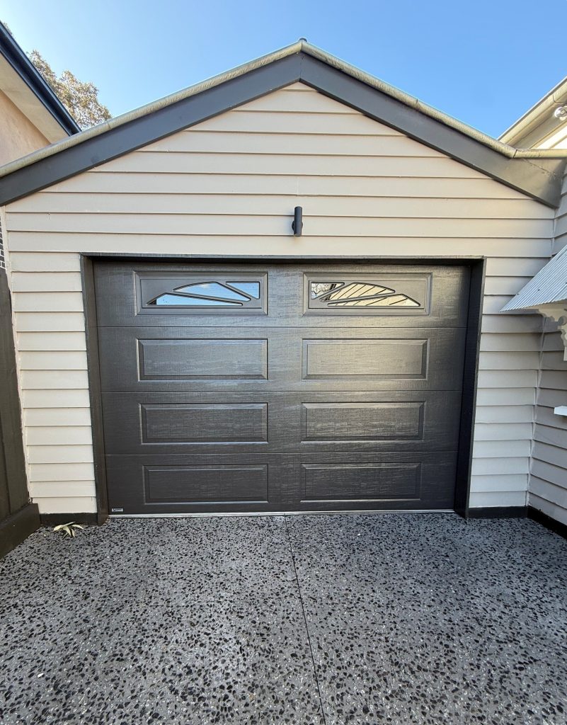 Gliderol Panel-Glide Sectional Door, Colorbond Monument, Hampton Style - Textured Finish with Hampton Sunset Windows