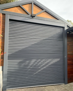 Taurean Roller Door, Colorbond Monument with Merlin Silent Drive Elite