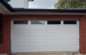 Steel-Line Sectional Door, Colorbond Surfmist, Ranch Style - Textured Finish with Ranch Plain Windows