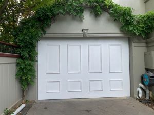 Custom made Tilt Door with Ply covering and timber mouldings.